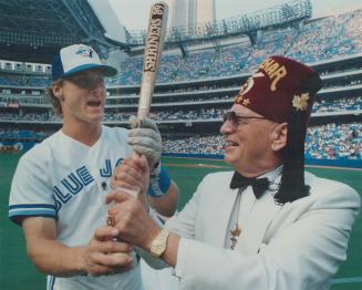 It was Shriners' Night at the SkyDome, where Jays' third baseman Kelly Grubber had a few tips for Edward McMullan of Calgary, Imperial Potentate.