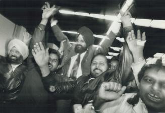 Victory is sweet: Gurbax Malhi is held aloft by supporters after he won Liberal riding nomination on third ballot yesterday