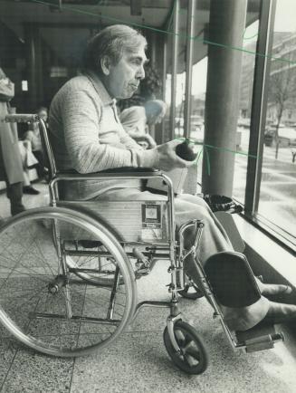 Nowhere to go: Frank Mariani, 61, has been living in his wheelchair in the hallways of the Queen Elizabeth Hospital since Monday when he was discharged