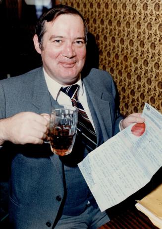 Victory drink: Graham McCready celebrates yesterday after winning a Small Claims Court battle for his tax rebate