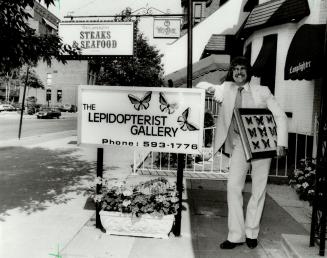 Selling uniqueness: Mac McDonald, owner of the Lepidopterist Gallery, which specializes in exotic butterflies mounted under glass, calls Elm St