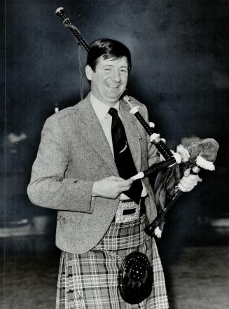 Champion piper: Visiting bagpipe judge Angus MacDonald poses with his pipes at Seneca College's Minkler Auditorium But he wouldn't play - to early in the morning, he said