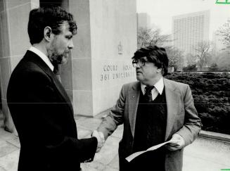 Stalemate ends: Hugh Macdonald, left, former president of the Toronto Chess Club, shakes hands with Gerald O'Neill outside court yesterday after O'Neill's damages suit was settled