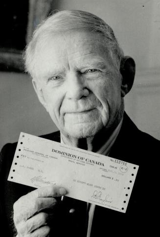 Andy McGee: Retired doctor shows off 42-year-old cheque for 89 cents.