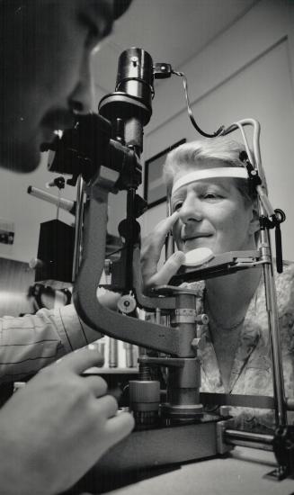 Alexandra McGary: Law clerk, 46, who lost the vision in her eye to cancer, is examined by Dr. Hugh McGowan, one of two surgeons to do the implant.