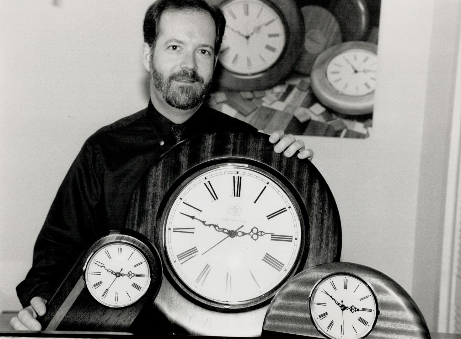 Right timing: Alan Mackie of Penetanguishene shows a few of his hand-made clocks which have become popular throughout the world