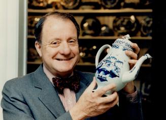 Museum bound: Don McLeish, of the Chelsea Shop, with an English pearlware coffee pot that is part of the collection of artifacts to be presented to the Nova Scotia Museum in Halifax