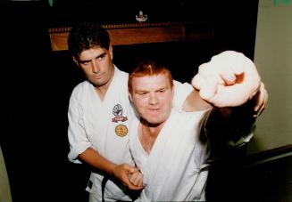 Getting close: Rob McMurray is learning martial arts with the help of his leisure buddy, Dave Couch