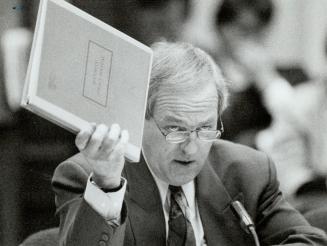 Martel probe: Ohip director Dr. Robert MacMillan waves government security policy manual during testimony yesterday. He said an aide to Frances Lankin, right, may have seen secret memo that sparked controversy regarding Shelley Martel, far right.