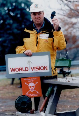 Phillip Maher from World Vision shows a variety of landmines