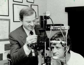 Progress recorded: Dr. Mark Mandelcorn of Mount Sinal tests eyes of Michel Paquet of Timmins, who was blinded in a mining accident. Mandelcorn, who says he has rarely seen such badly damaged eyes, performed the operations that have given Paquet normal vision in one eye.