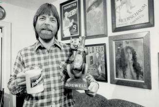 Avid collector: Radio copy writer Dave Marrotte with a sampling of his beer and tobacco memorabilia