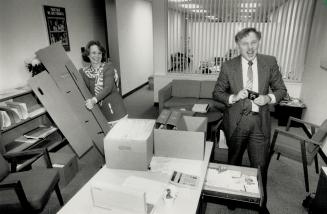 Musical chairs, Ward 16 councillor Malcolm Martini, unseated after a recount in favor of Michael Walker, cheerfully packs his possessions with help from aide Sandra Monteath