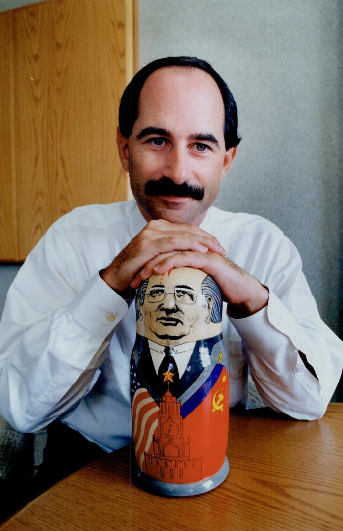 Privatizing expert: Roger Martin, holding this Soviet toy, isn't playing around teaching the Russians how to operate a free enterprise system.