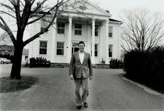 White house: Home builder Gord Mason stands in front of the 140-year-old Georgian mansion in Etobicoke that has served as his firm's headquarters for 15 years