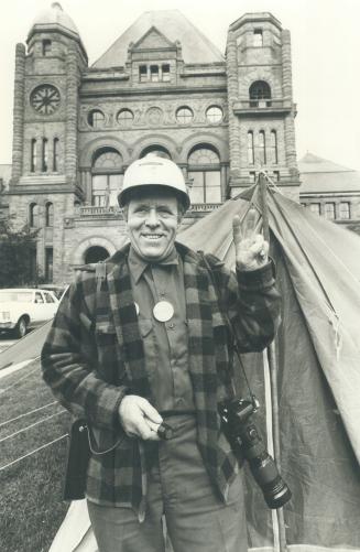 He'll stay until Lake Ontario freezes over, says Guido Merkl of Dryden who pitched his tent at Queen's Park on Wednesday to bolster his claim that the provincial government owes him $2,000 for damages when a house was removed from a construction site he was working on last year