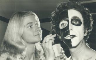 Face-painting allows people to take off their masks and let the 'real me' out, says psychologist Harold Miller, being made up by wife, Harriet