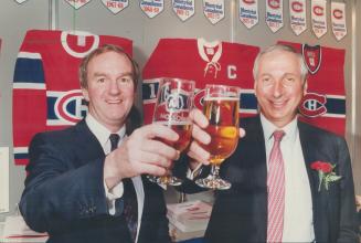 Here's to US: Company chairman Eric Molson, left, and president Mickey Cohen attend Molson's annual meeting in Toronto