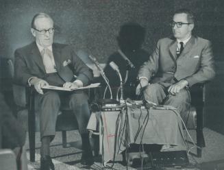 Trevor Moore, chairman of a committee which studied the impact of foreign ownership in the Canadian stock and bond business, is shown at press conference