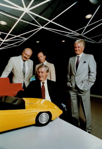 Wind tests: DSMA chairman George Meagher, front, vicepresidents Lorne Wilde, left, and Doug Wilde and president George Bremner check a model car after wind tests