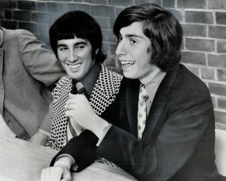 Just 5 votes apart in the final voting for the NDP nomination in York Mills, 21-year-old Mike Morrone (left) sits on platform beside 18-year-old John Syrtash as they field questions from meeting
