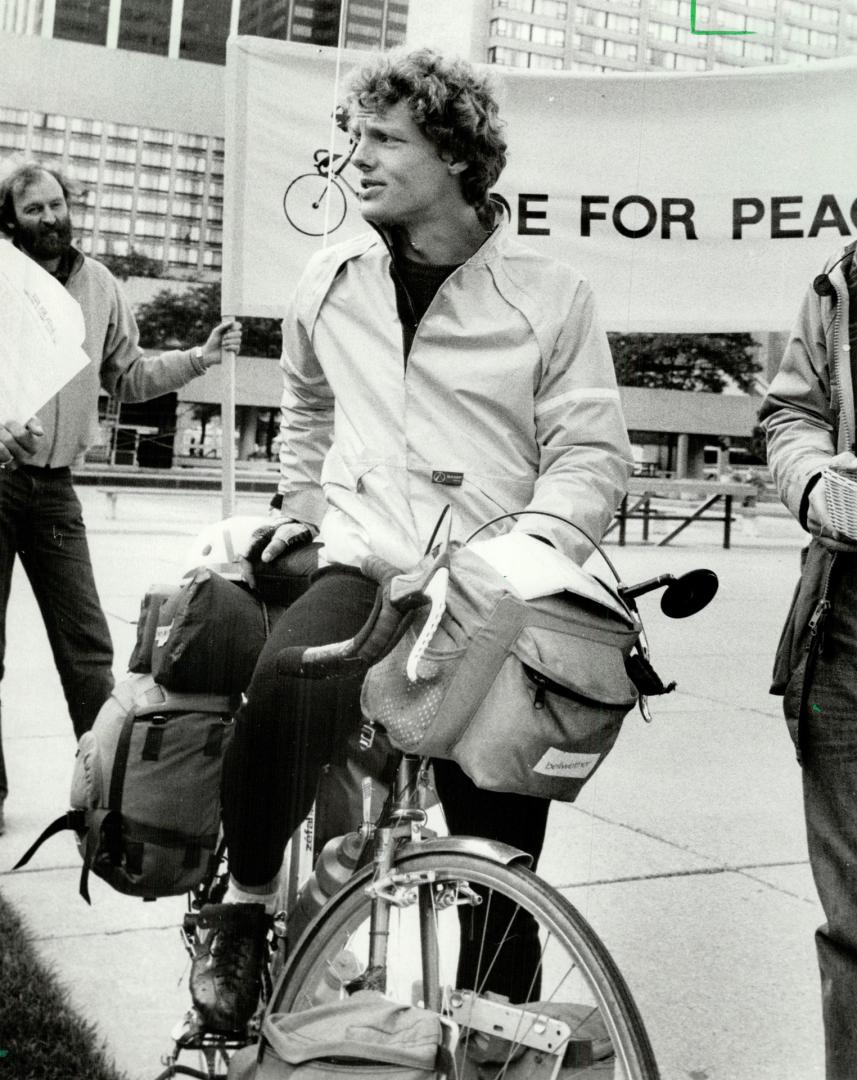 Pedalling message: Doug Mohr, 26, a doctoral student at the University of Waterloo, pulled into Nathan Phillips Square yesterday on his cross-Canada trip to raise money to fight the arms race