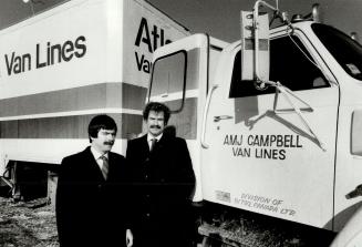 On the move: Tim Moore, right, president of A.M.J. Campbell Van Lines, is shown with his brother, Ted, a vice-president.