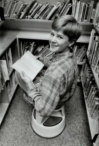Keir Moulton: Student of the year, in his school library, loves to read Sherlock Holmes mysteries, science fiction and history.