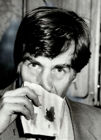 Bloody loser: Giles Muir tends his bloody nose. He claims winner Nola Crewe punched him.
