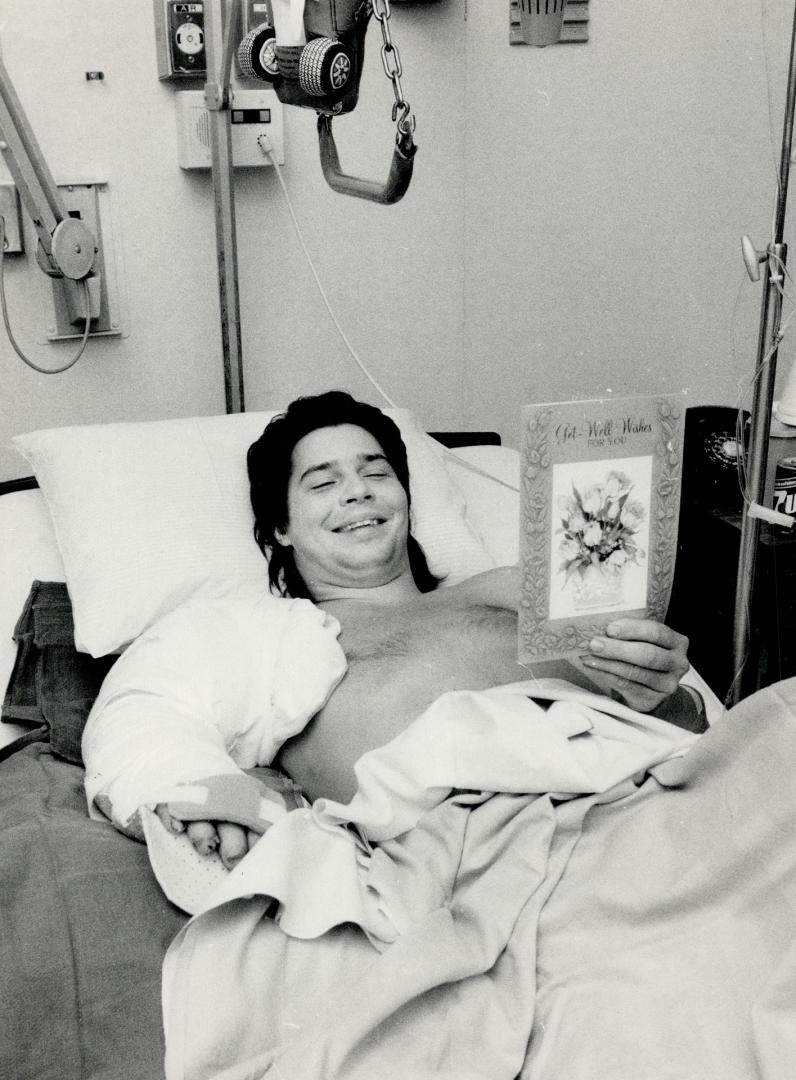 Saved in time: Steve Navratil smiles at a get-well card in his room at St