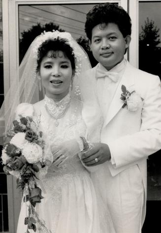 Glittering ceremony: Tham Nguyen poses at her wedding in metro yesterday with Jewels seized last week when groom Sanh Nguyen tried to enter Canada.