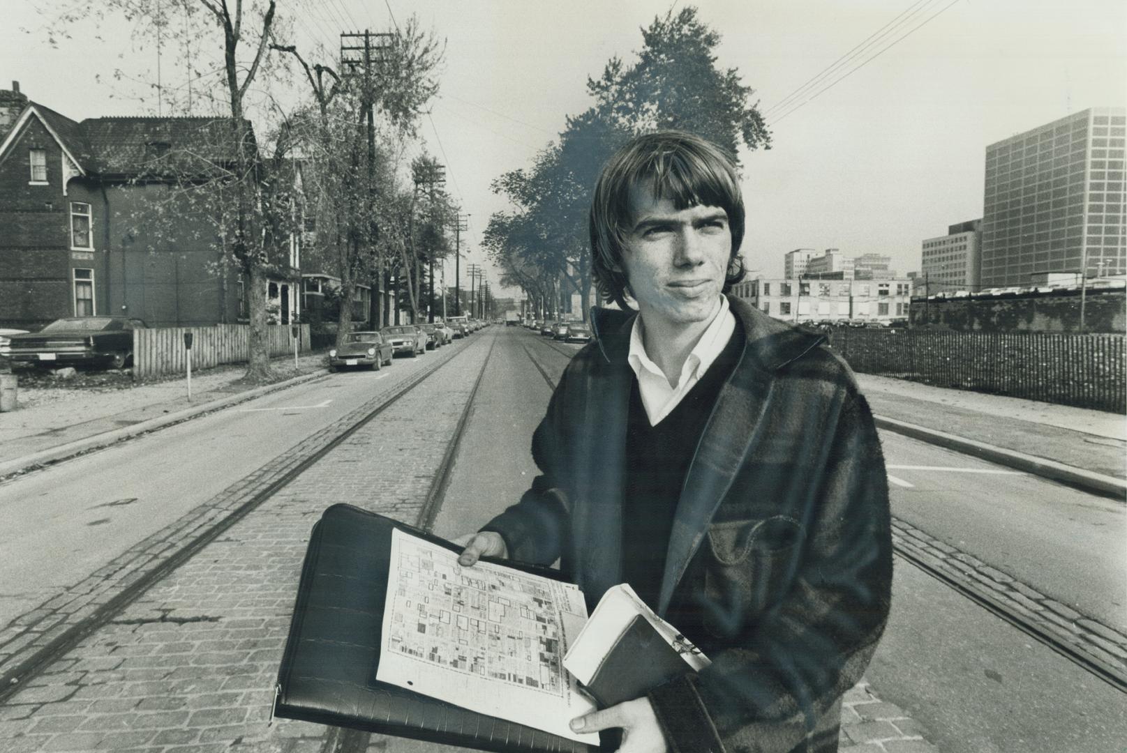 Richard Peachey stands on McCaul St