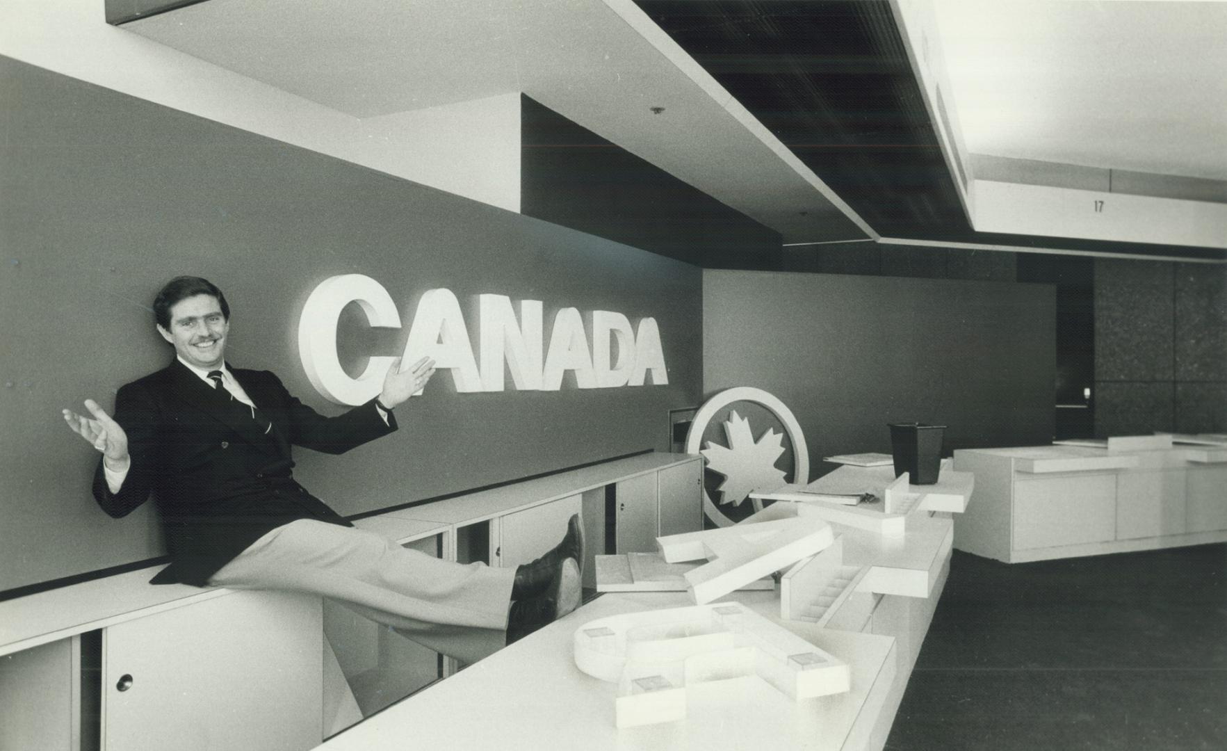 Sitting pretty: Ed Pennock, left, of Charles Schwab Canada, plans to offer no-frills service from former Air Canada ticket office on Bay St.