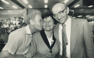 Wartime friends: Irving Posesorski, left, and brother Jack greet Helena Kielbasa at Pearson International Airport yesterday after her arrival from Poland