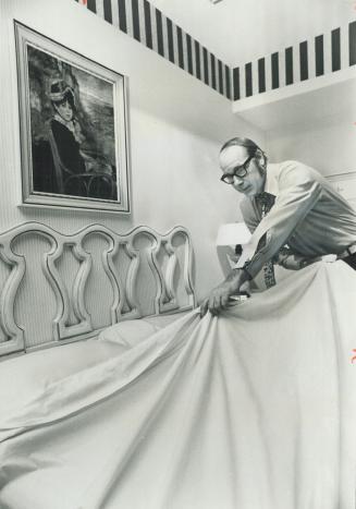 The chief engineer of the Toronto Airport Hilton Hotel, Dennis Potter, shows his bed-making skill on a weekend when about 40 of the hotel's 225 jobs were unfilled and a convention was blooked in