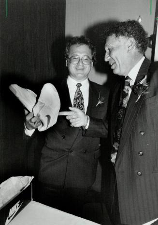 Poised for rebound: Premdor president Phillip Orsino, left, holds gift from chairman Sol Spears.