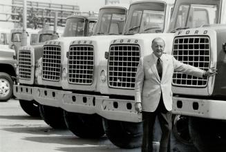 Big trucks still rule the highways: Don Patterson, with some of the vehicles his Sherway Ford Truck sells, says tailoring trucks to the job is vital if costs are to be kept down