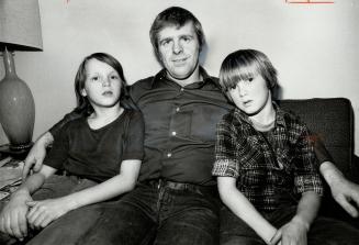 Risked lives: Andy Patterson, 32, flanked by Dean Ribble (left), 12, and his brother, George, 10, dragged Patterson's 12-year-old son, Billy, screaming from a Mississauga building after 8,000 volts shot through the boy's body when he caught a foot in a transformer room