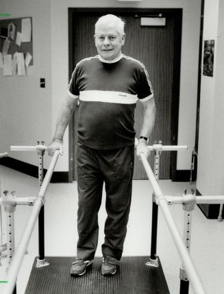 Recovering: Charlie Patterson, who developed the modern hockey helmet, convalesces by working on parallel bars.