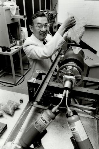 Something for nothing: Engineer David Pei demonstrates a microwave baking process using peanuts at his University of Waterloo lab