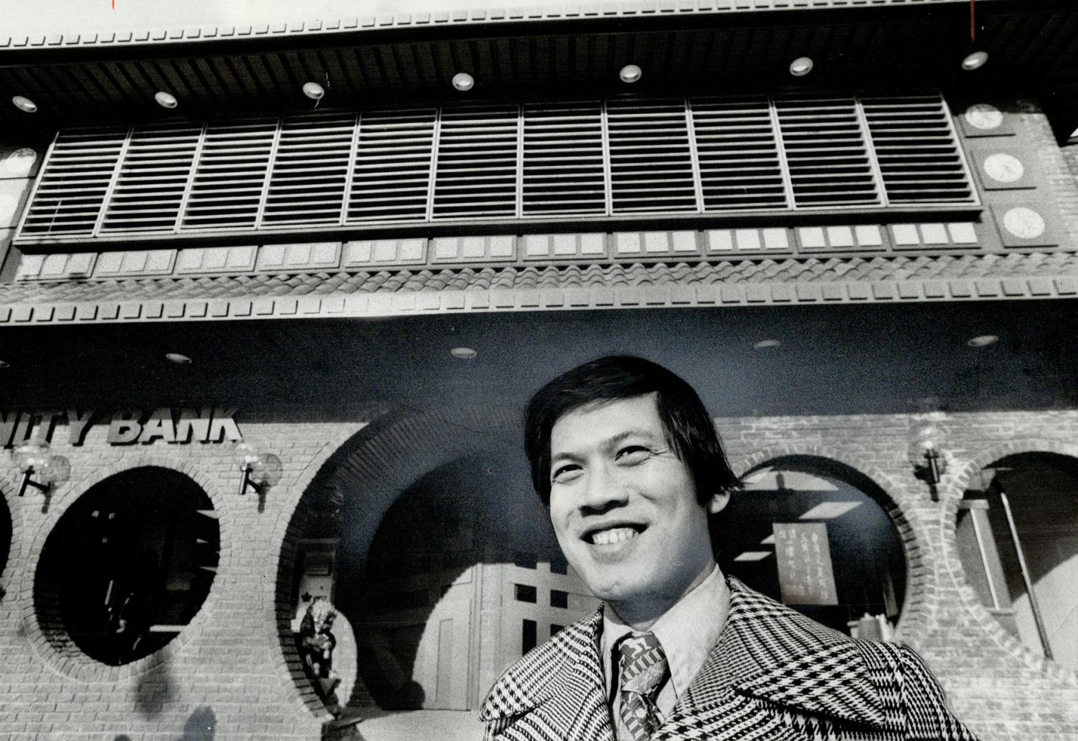 Domingo Penaloza stands in front of Ming Court of Dundas Street