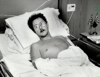 Brave skier: Ian Phillips recovers in hospital, where his feet were amputated after after his four-day ordeal lost in Wyoming mountains