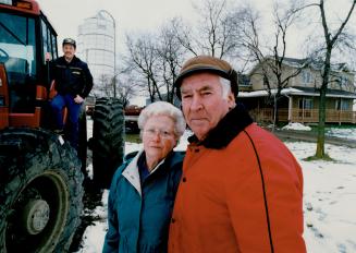 Dumped on: Newton and Leona Piercey and their son Paul, in tractor, were told last Friday their Caledon farm, near Bolton, is one of five remaining contenders to be the next regional dump for Peel