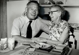 Effort: Harry Pilkington, campaign chairman for this year's United Appeal a hug and a free food sample from Muriel Burns, 90, when he visited her Parkdale apartment