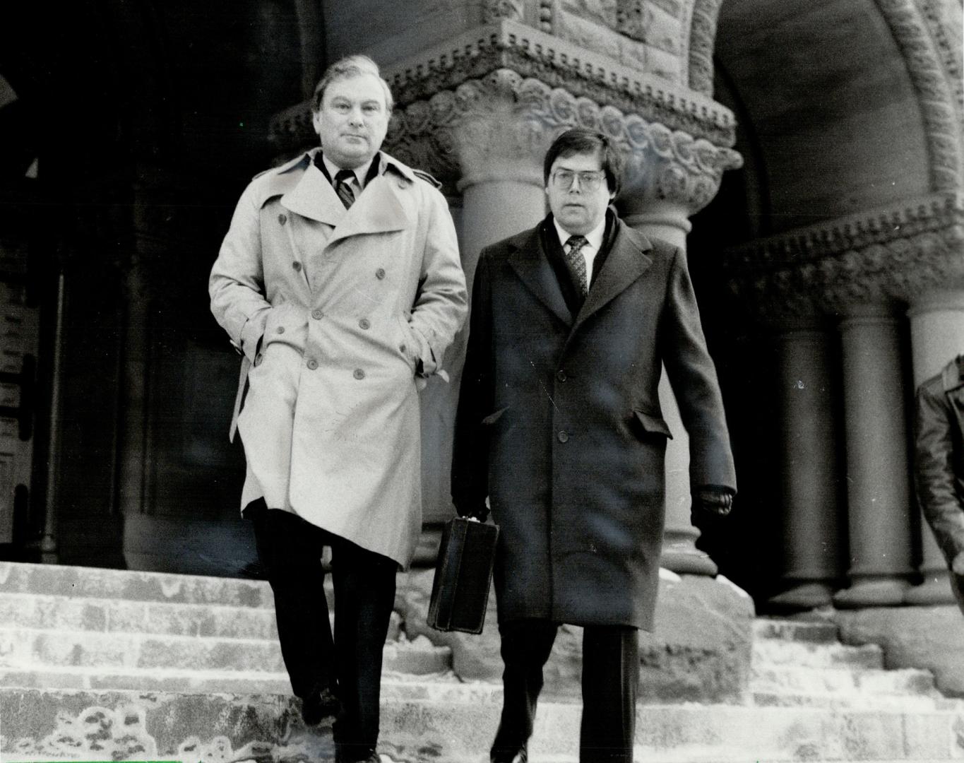 Lawyer charged: Joseph Pomerant (left), charged in connection with the alleged misappropriation of $500,000 belonging to a client, leaves court todya with his counsel Morris Manning