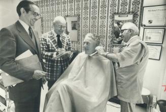 It's a fine clipping -- with real tradition, The barber shop of Nick Rang, right, on Toronto St