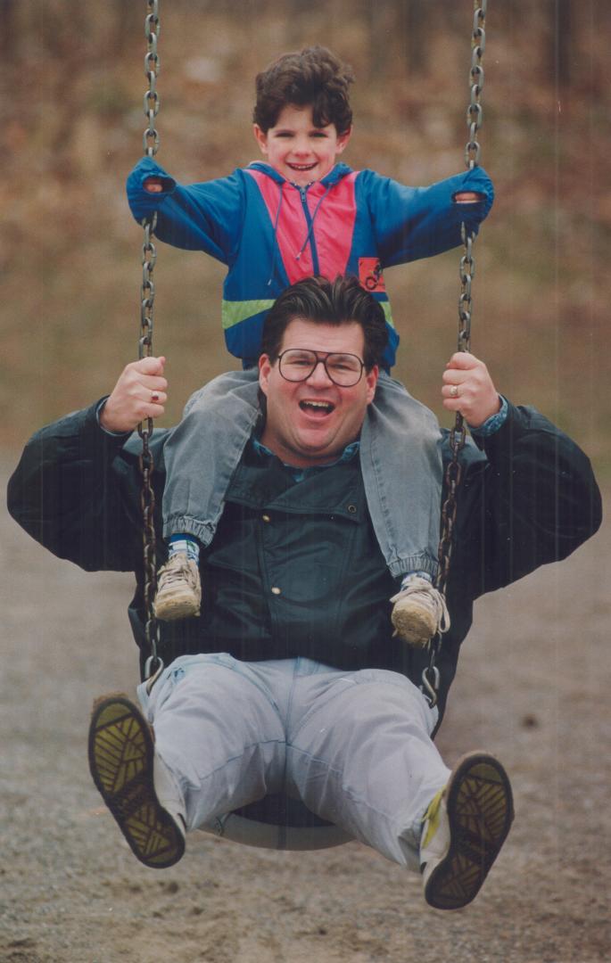 Head and shoulders above the rest, Craig Roberts, 28, of Mississauga gives Little Brother Justin Sopha a ride on a pair of wide shoulders.