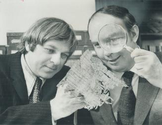 Just a bunch of litter to ancient Egyptians 2,000 years ago, scraps of papyrus being checked by University of Toronto Professor Alan Samuel (left) and Donald Macdonald, federal minister of energy, were used to wrap mummies by folk too poor to afford linen