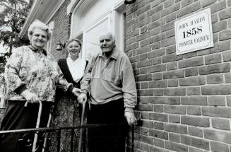 Happy Home: Peter and Hilda Putman are visited by Karen Pipes (centre) of Halton Helping Hands. They say the agency helps them cope with their home.