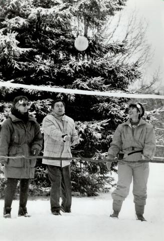 Snow pleasures: Flanked by Susan Rovet, left, and Sue Fox, Councillor Mario Racco lofts a volleyball - to promote Vaughan's Winterfest 1993 on Sunday at Uplands Golf and Ski Centre